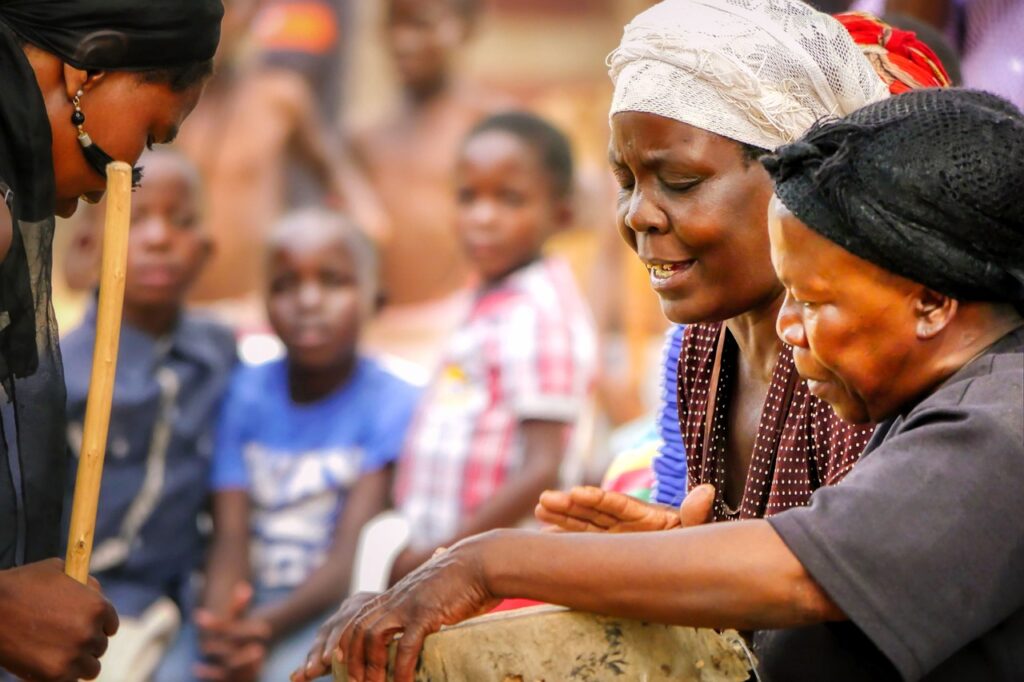 Explore Nigeria- African women playing on drums